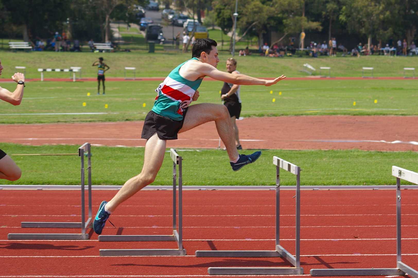 Harry leaping over a 400m hurdle