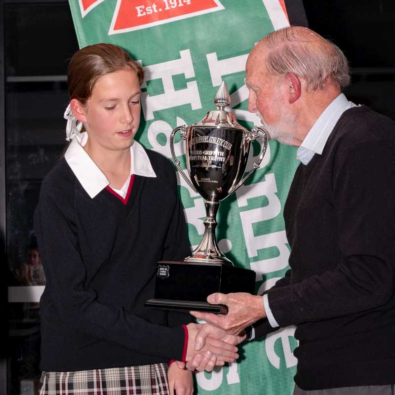 Carla being presented the Woods/Griffth Trophy by John Griffith